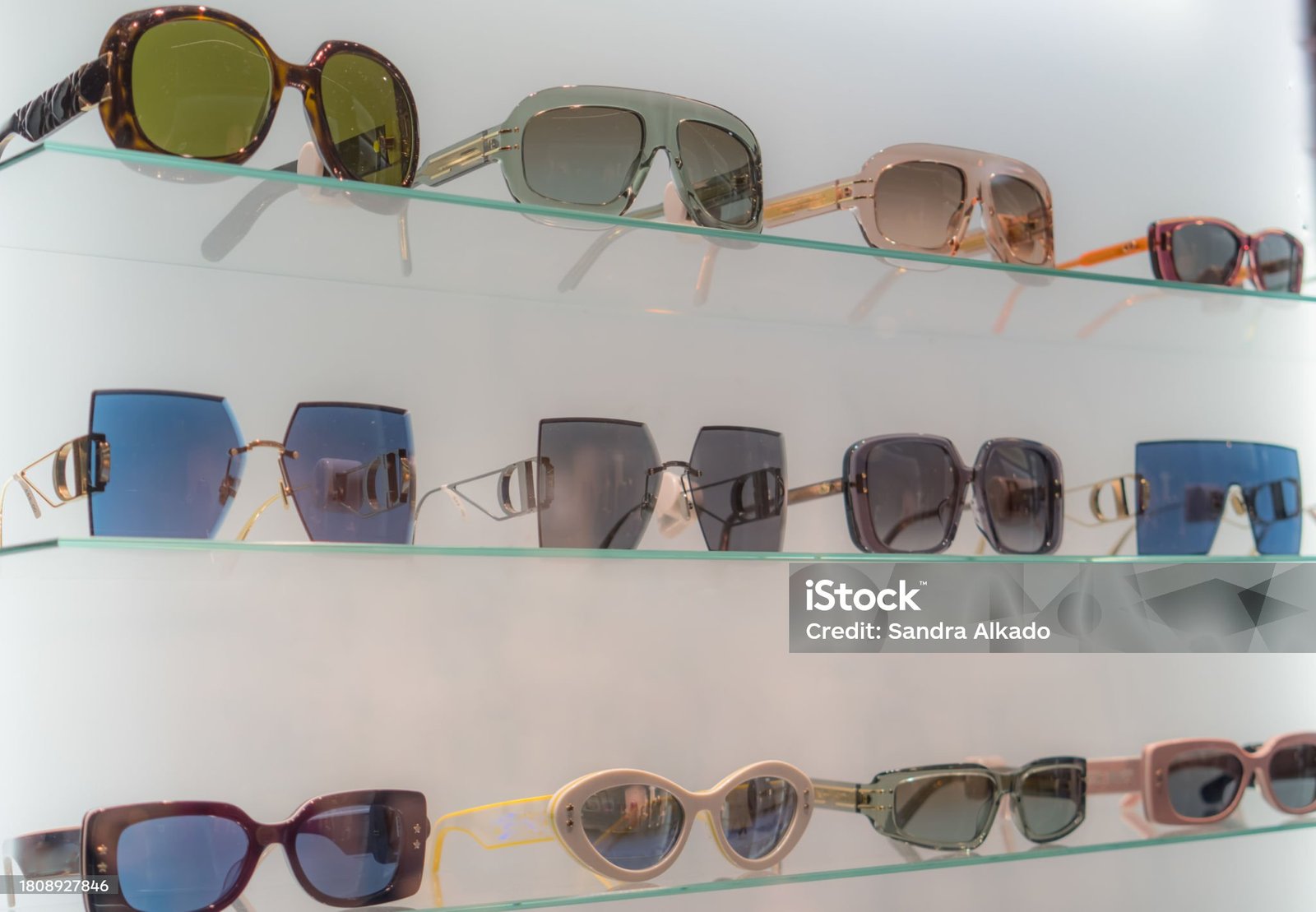 View through the shop window: Sunglasses collection in a illuminated showcase